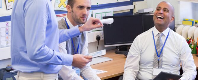 Teachers chatting in staff room
